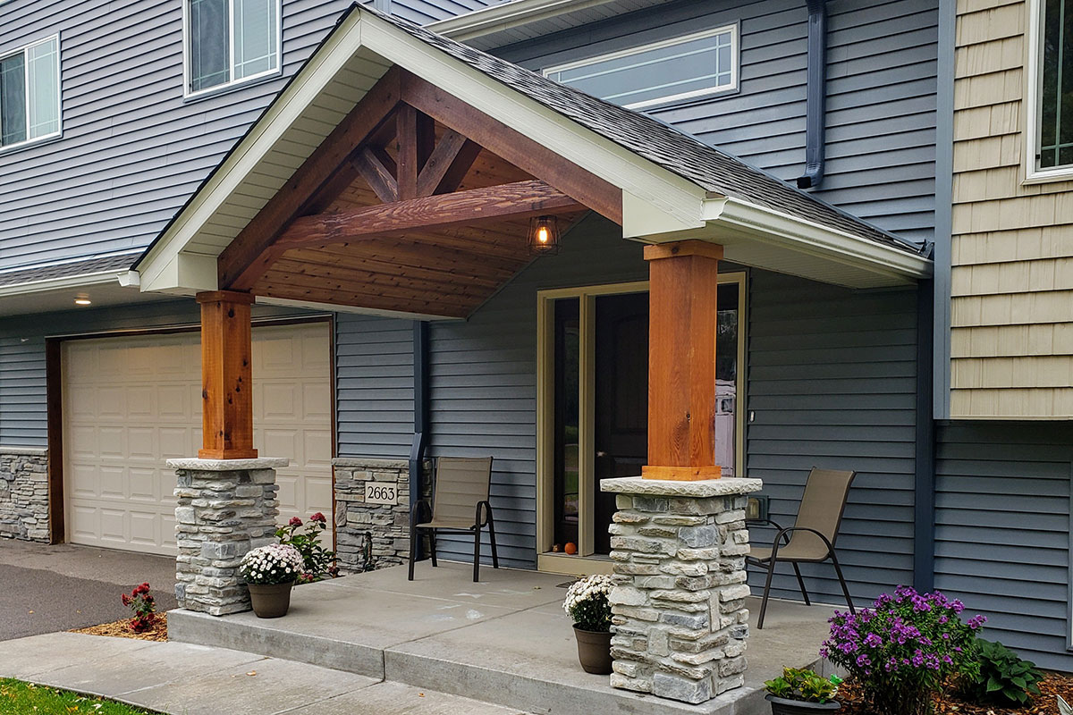 Front porch addition with stone and wood columns